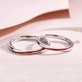 Clameco | Ring mit rotem Faden .